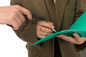 man being forced at gun point to sign an agreement